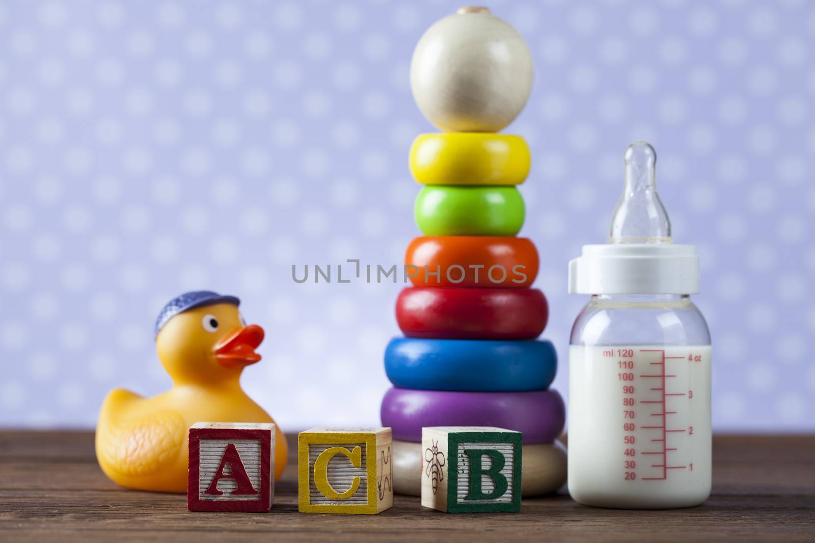 Children's World toy on a wooden background. Studio shot]