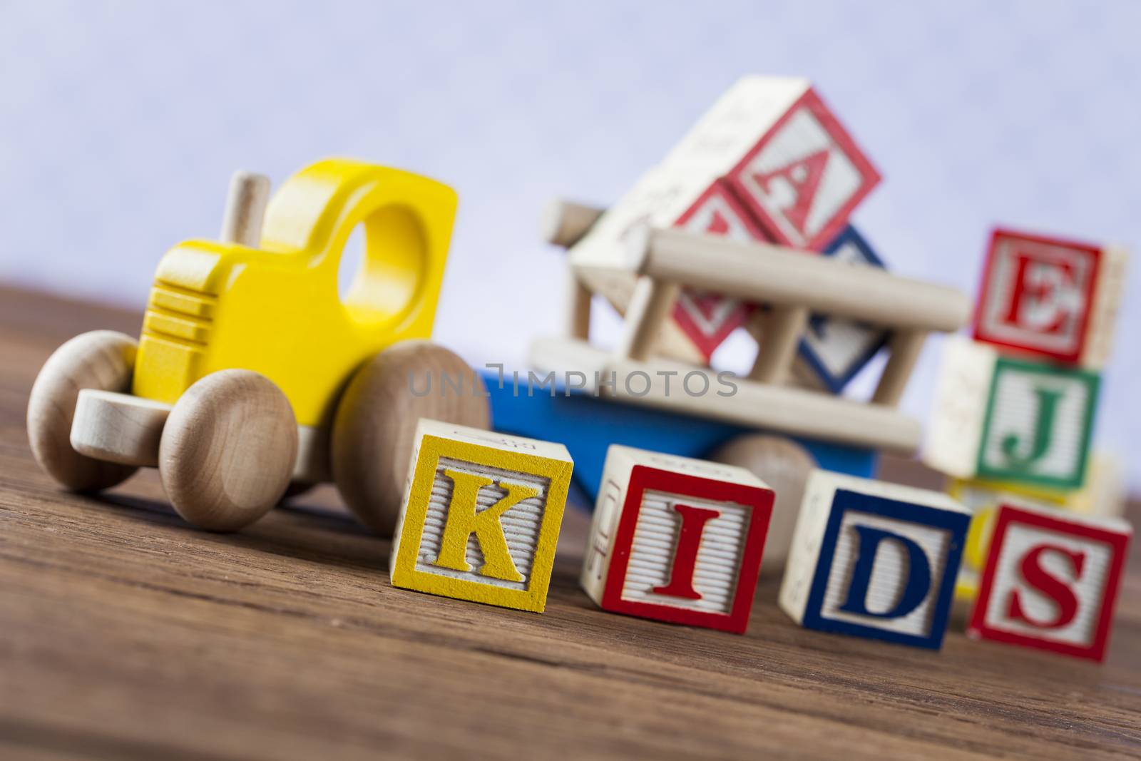 Children's World toy on a wooden background. Studio shot]