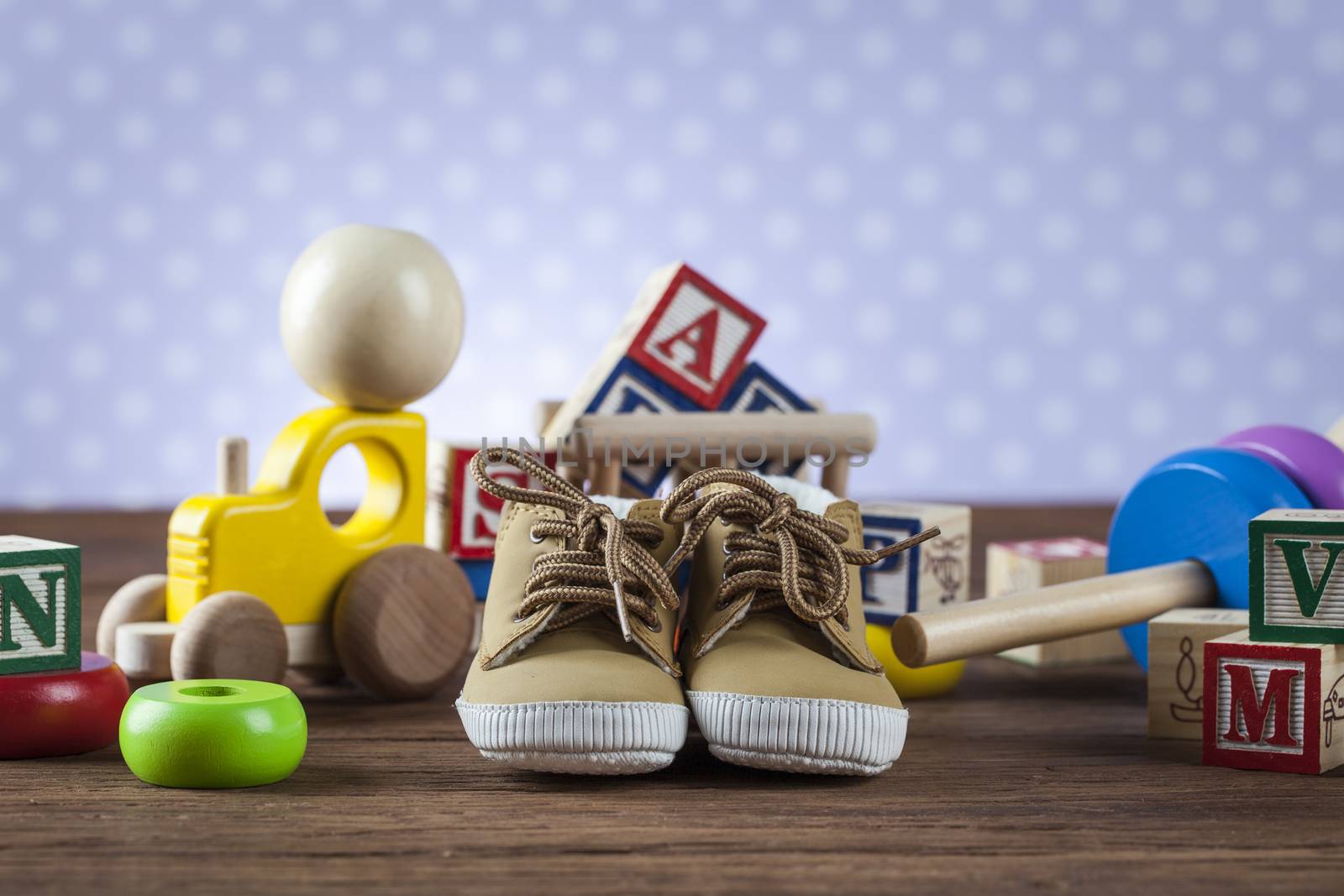 Children's World toy on a wooden background. Studio shot]