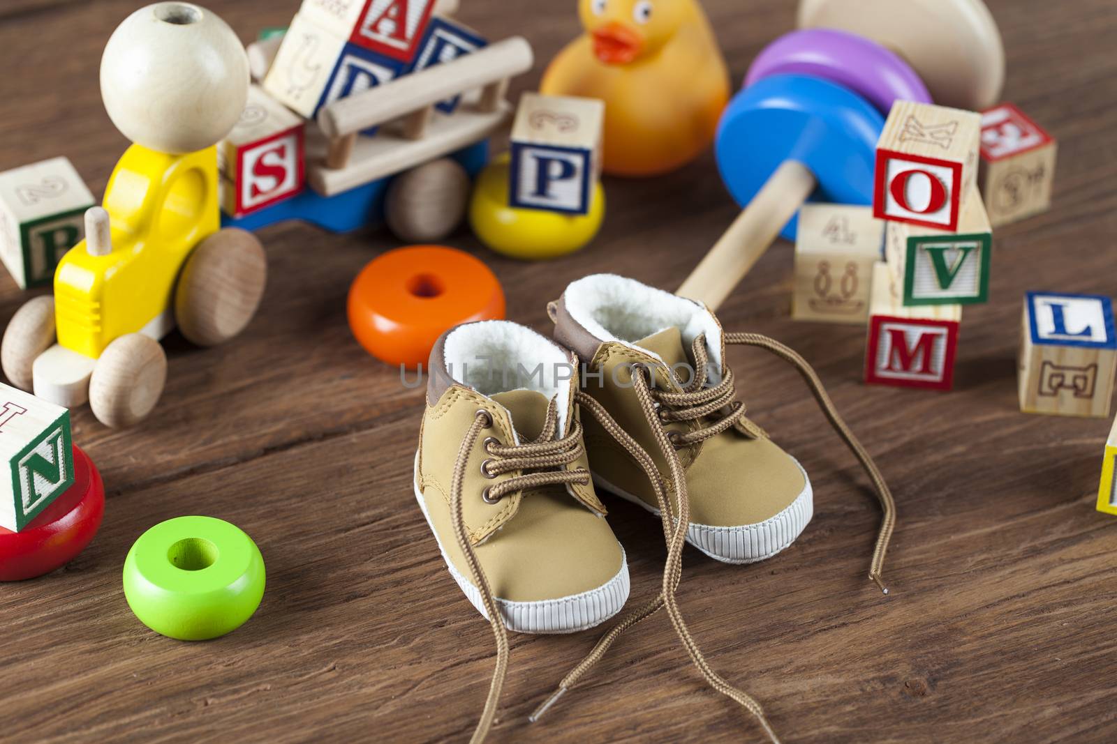 Children's World toy on a wooden background. Studio shot]