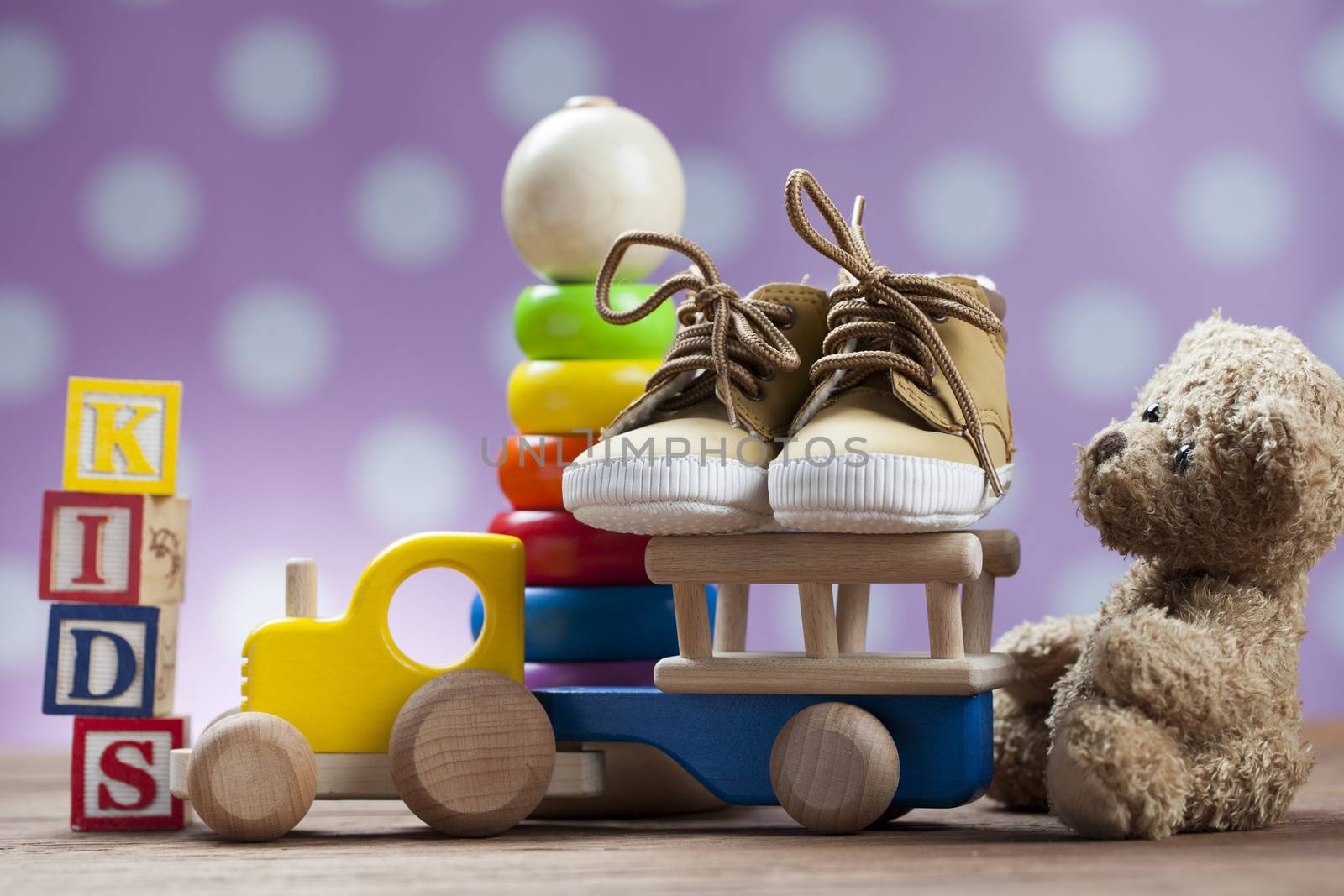 Children's World toy on a wooden background. Studio shot]