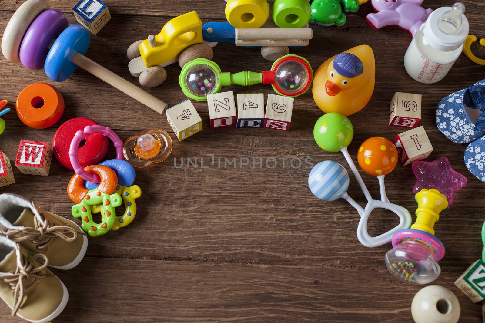 Children's World toy on a wooden background. Studio shot]