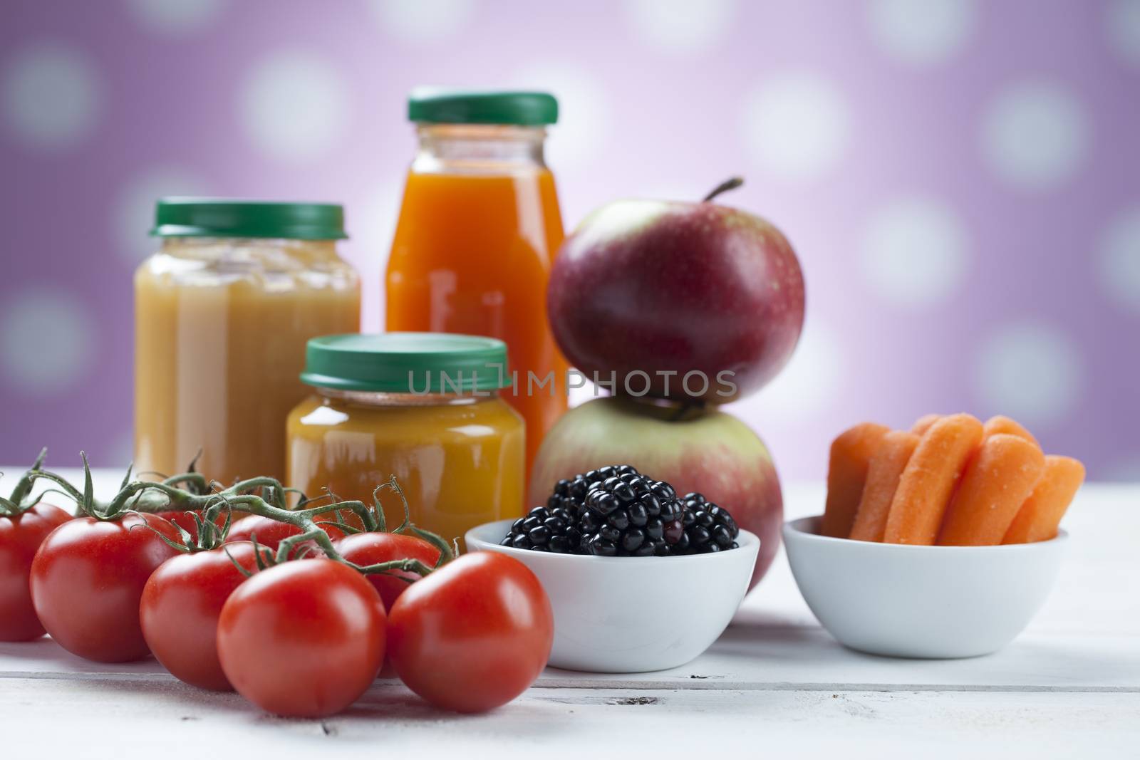 healthy ready-made baby food on a wooden table.