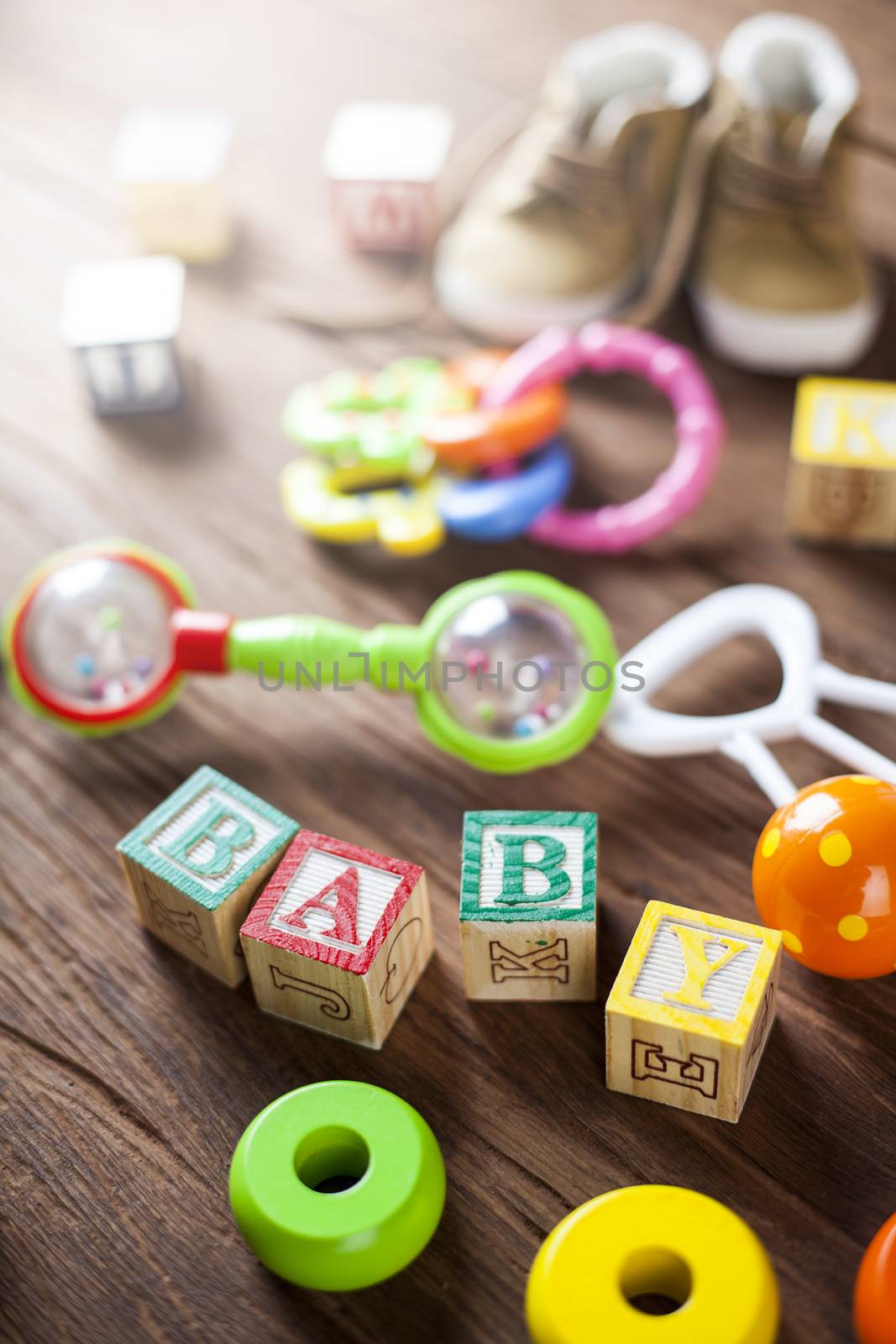 Children's World toy on a wooden background. Studio shot]