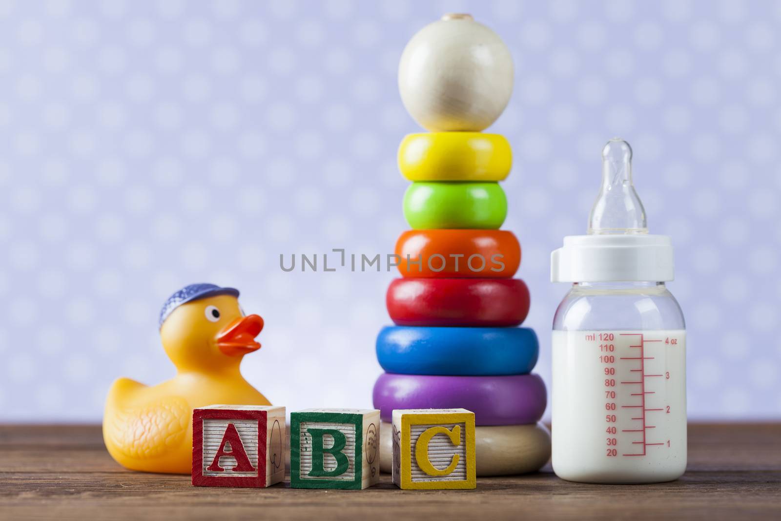 Children's World toy on a wooden background. Studio shot]