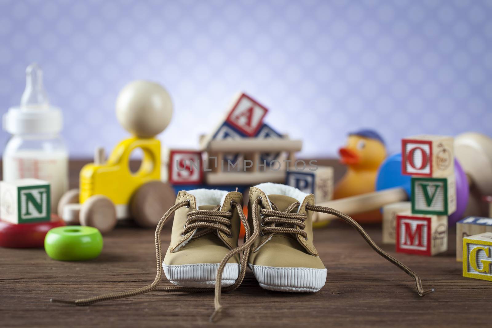 Children's World toy on a wooden background. Studio shot]