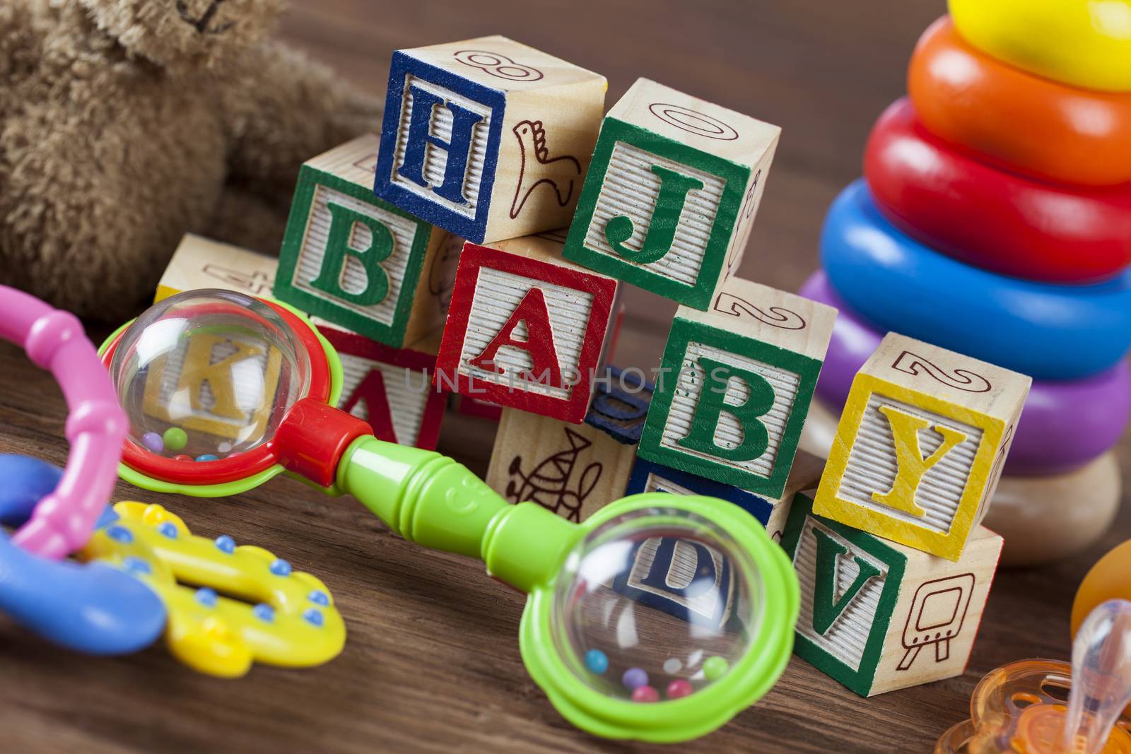 Children's World toy on a wooden background. Studio shot]