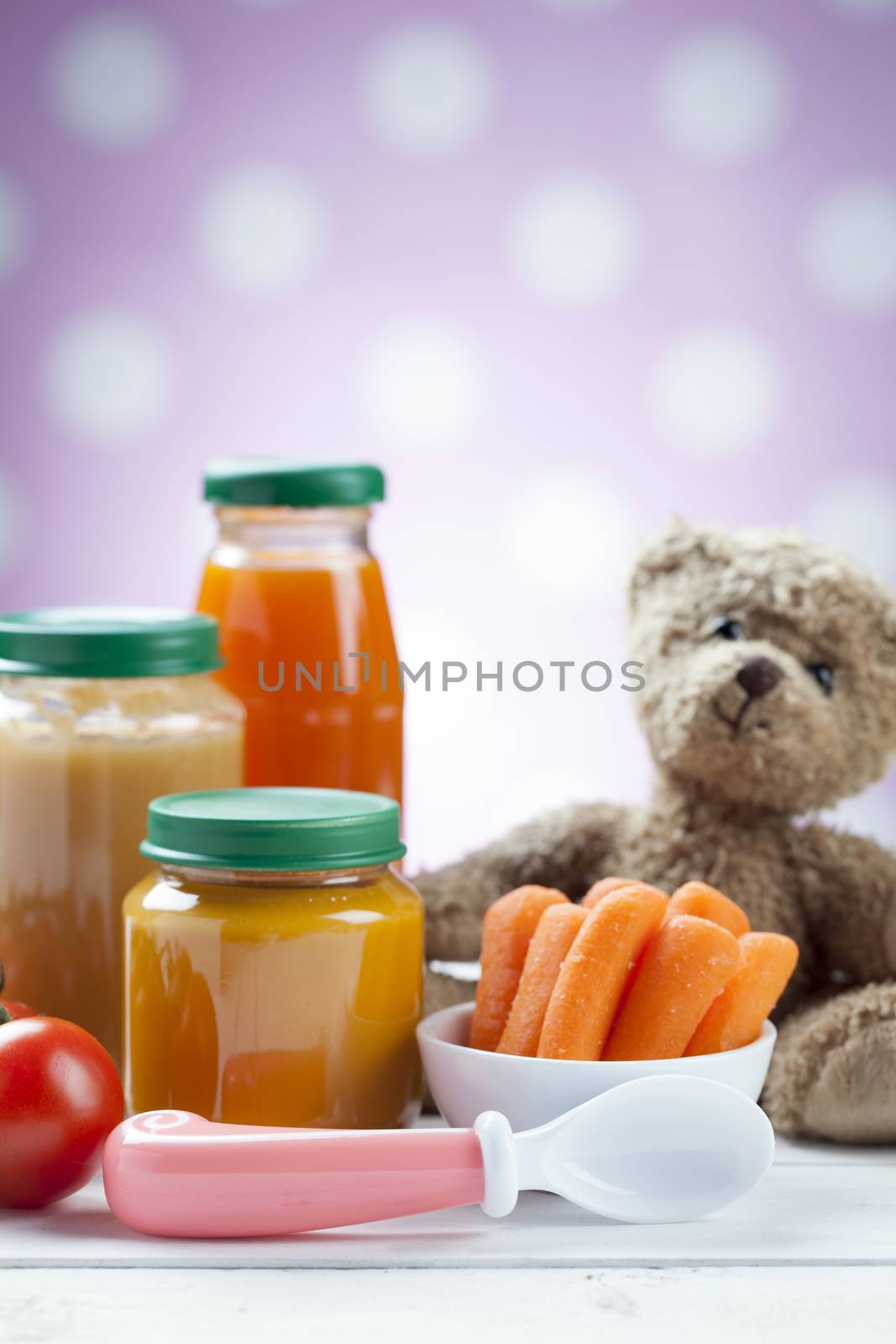 healthy ready-made baby food on a wooden table.