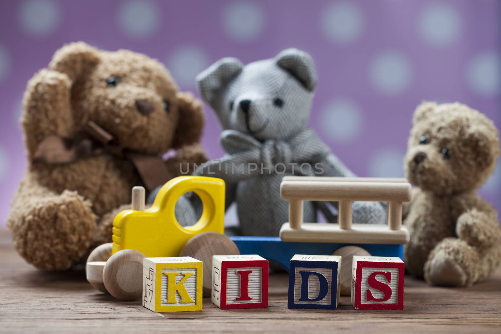 Children's World toy on a wooden background. Studio shot]