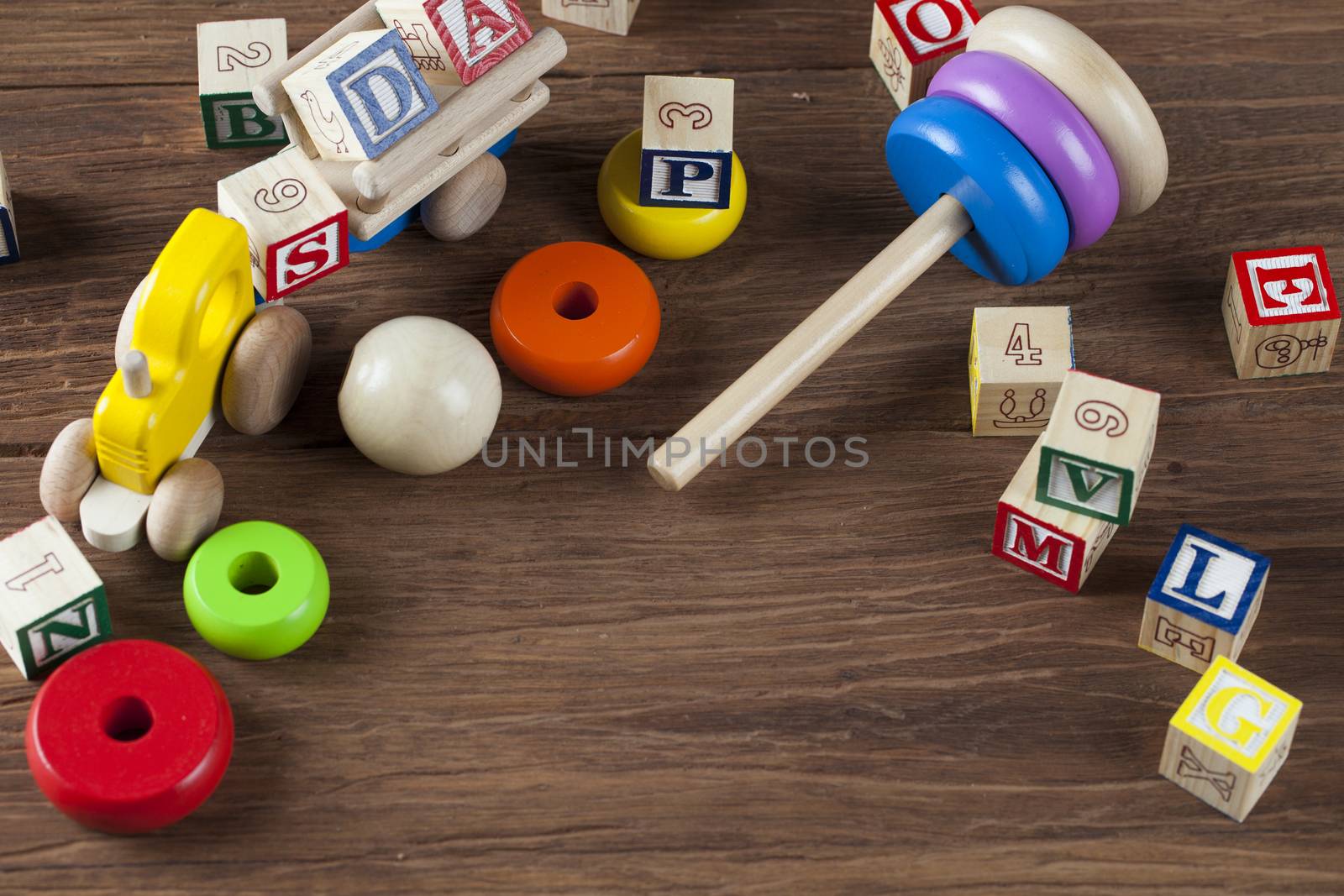 Children's World toy on a wooden background. Studio shot]