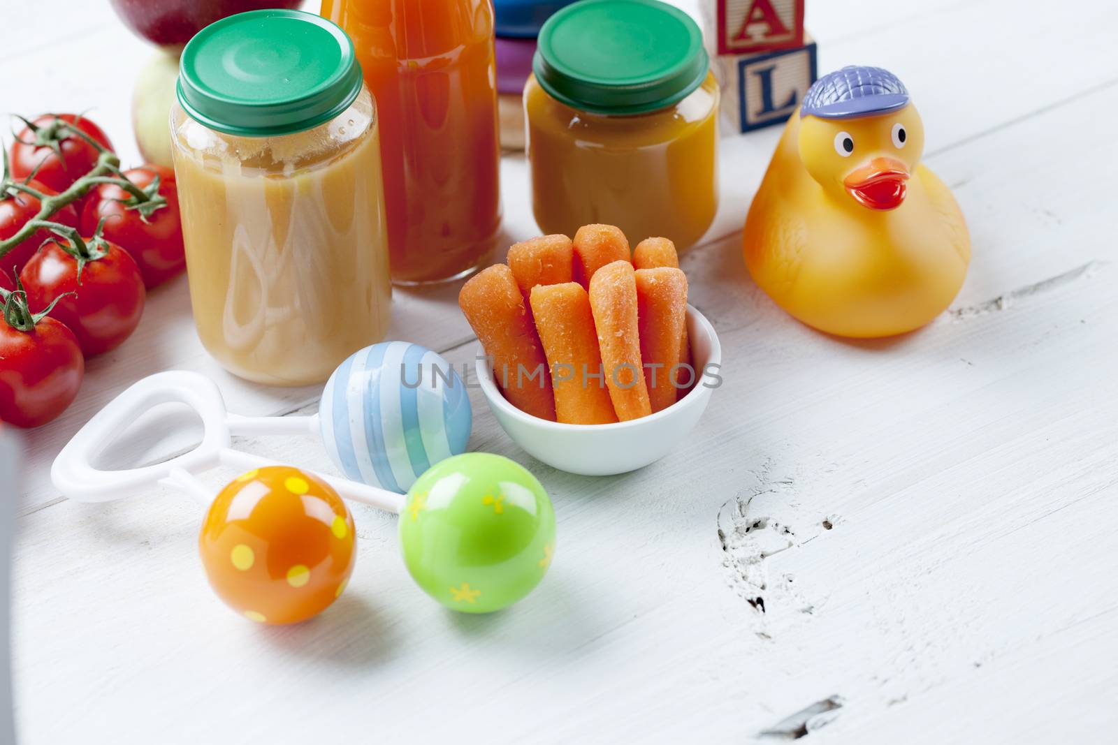 healthy ready-made baby food on a wooden table.