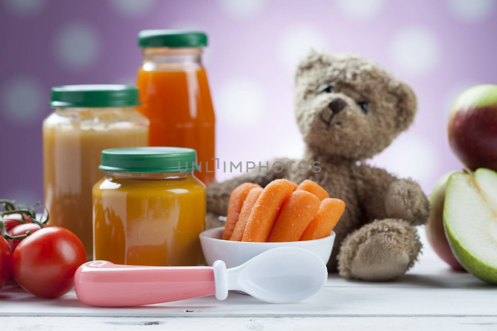 healthy ready-made baby food on a wooden table.