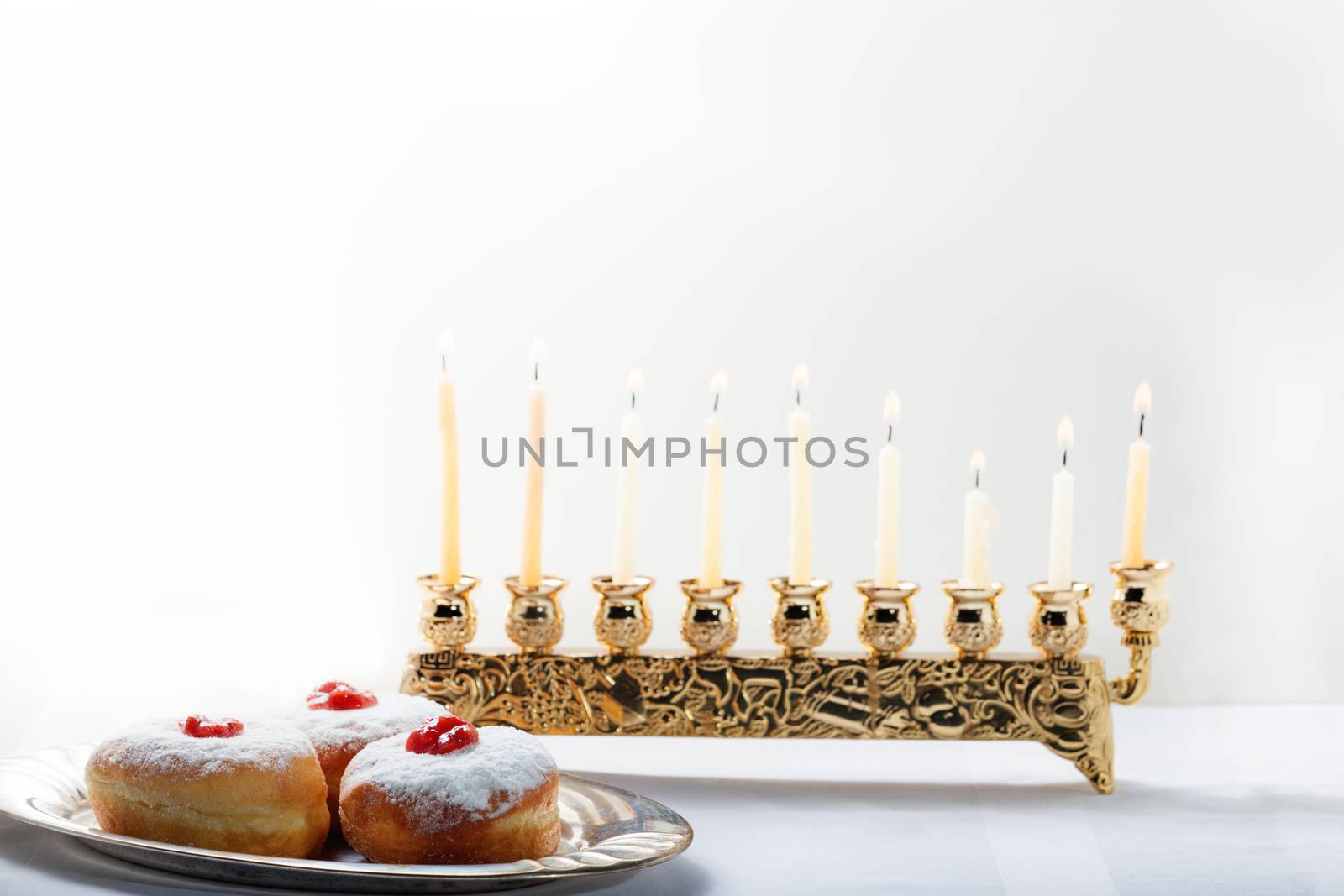 Sufganiyot and nine branched menora for Hanukkah