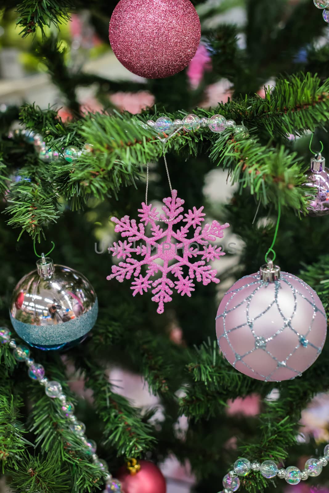 Christmas decorations on a Christmas tree. Christmas decorations like a snowflake