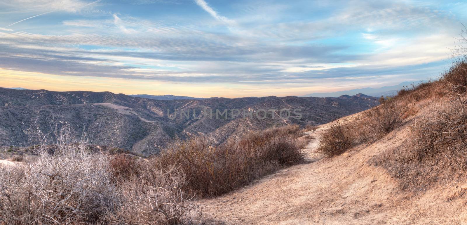 Top of the World hiking trail dirt road in the wilderness of Laguna Beach, California at sunset