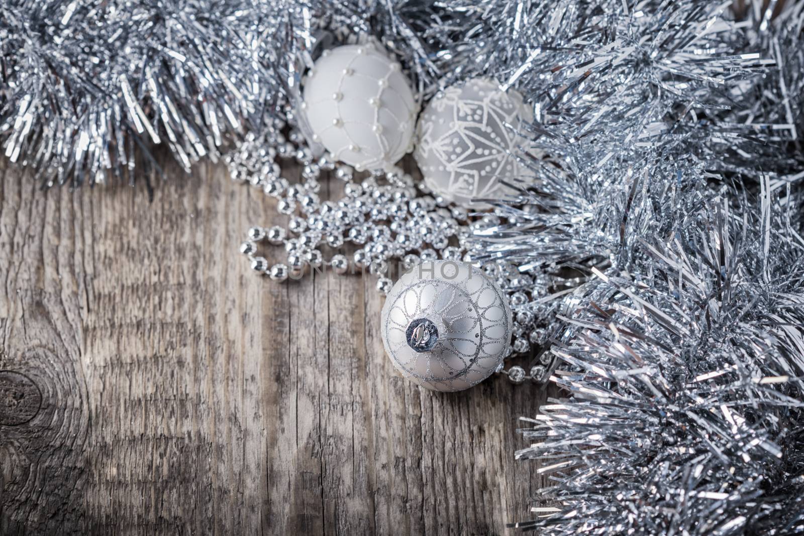 White christmas balls on a wooden background by supercat67