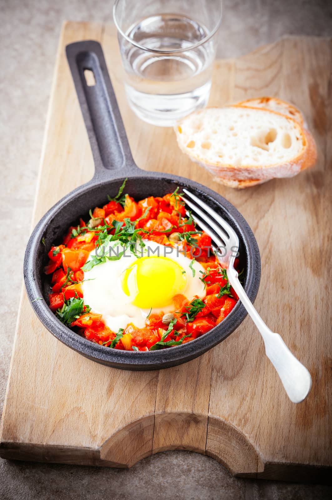 Traditional middle eastern dish of shakshuka in a pan by supercat67
