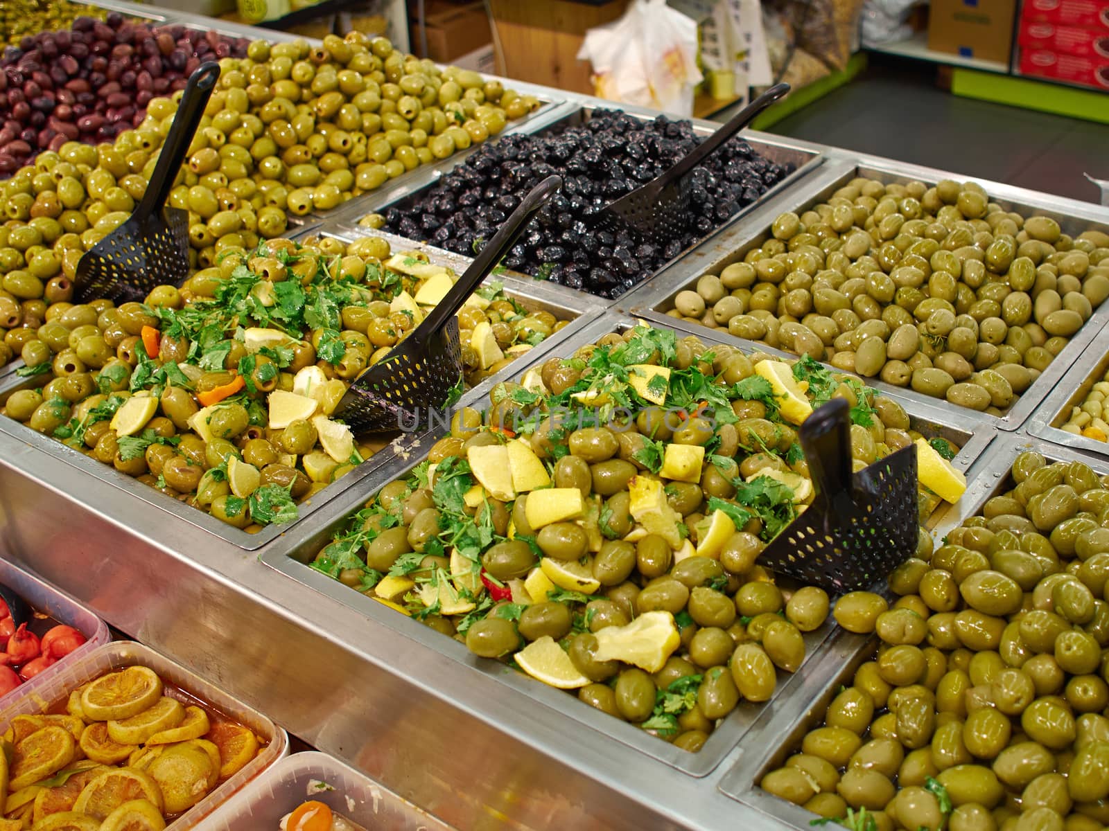 Selection of Mediterranean style pickled green and black olives for sale