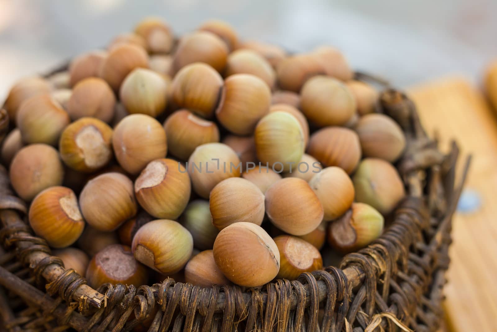 A basket of toasted hazelnuts inviting