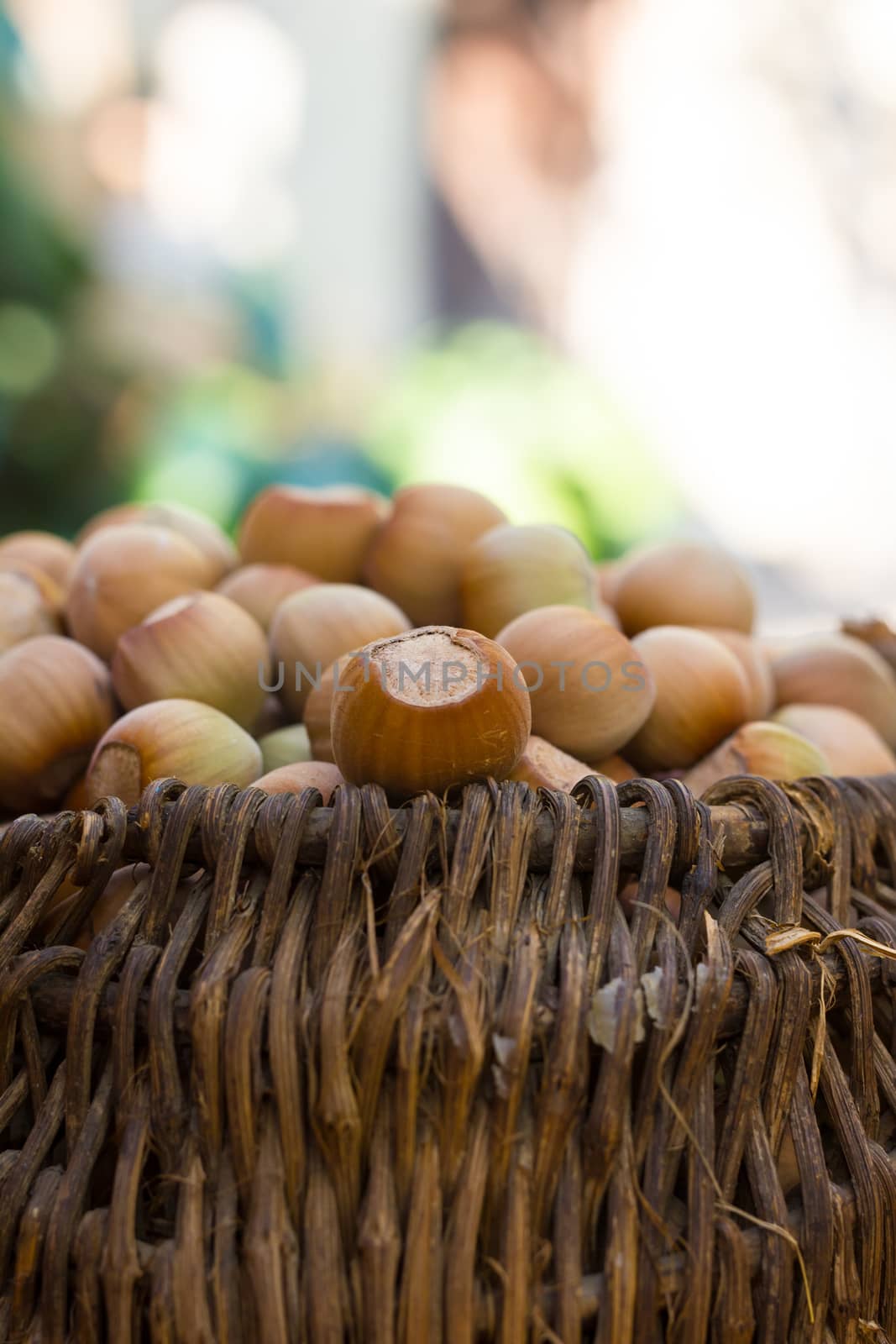 A basket of toasted hazelnuts inviting by maggee