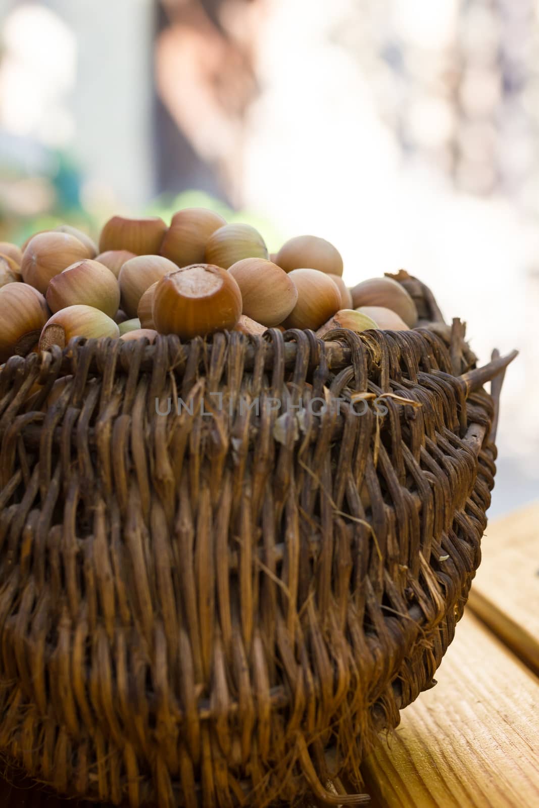 A basket of toasted hazelnuts inviting by maggee