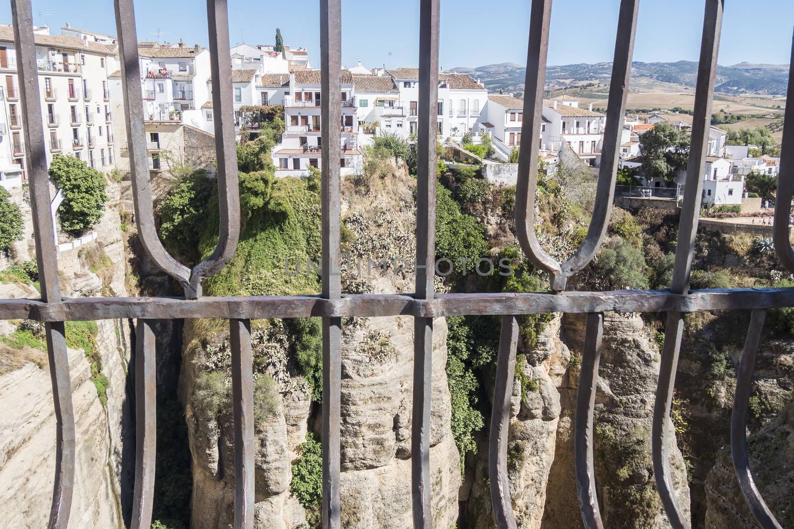 View from the new Bridge over Guadalevin River in Ronda, Malaga, Spain. Popular landmark in the evening