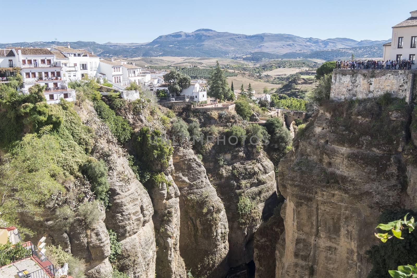 View from the new Bridge over Guadalevin River in Ronda, Malaga, Spain. Popular landmark in the evening