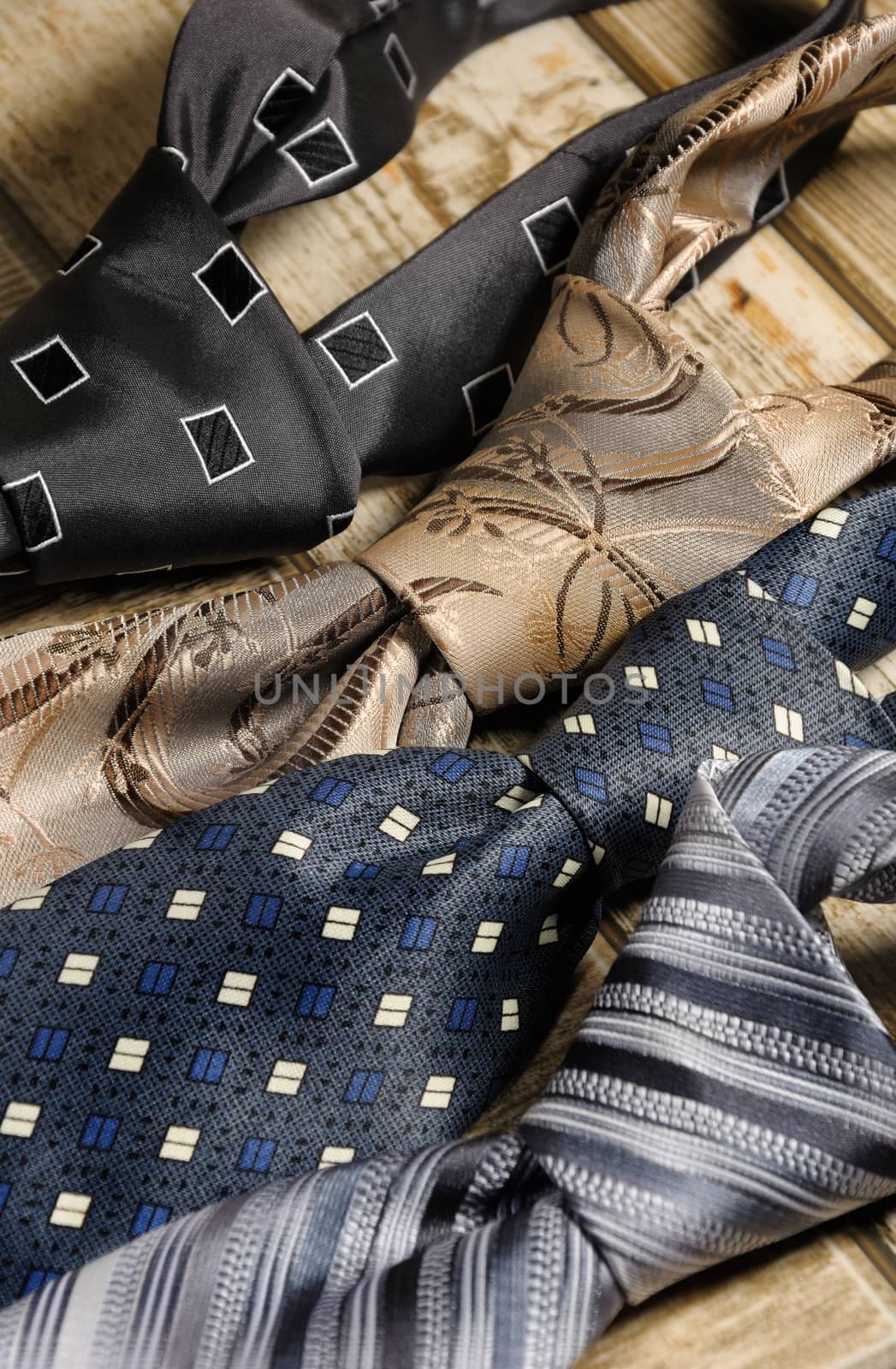 a variety of neckties knotted closeup