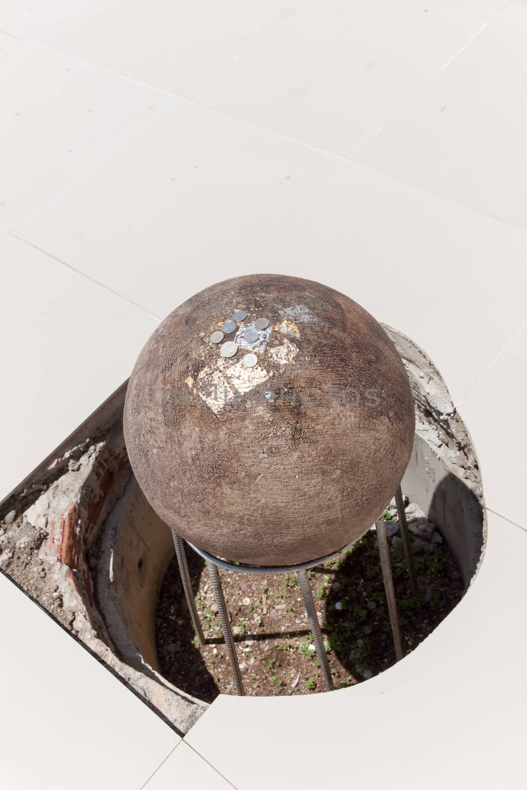 Some sacred marker spheres through ceremony (LUUK NIMIT) need to be buried in the temple compound around church temple in Buddhism. Thailand.