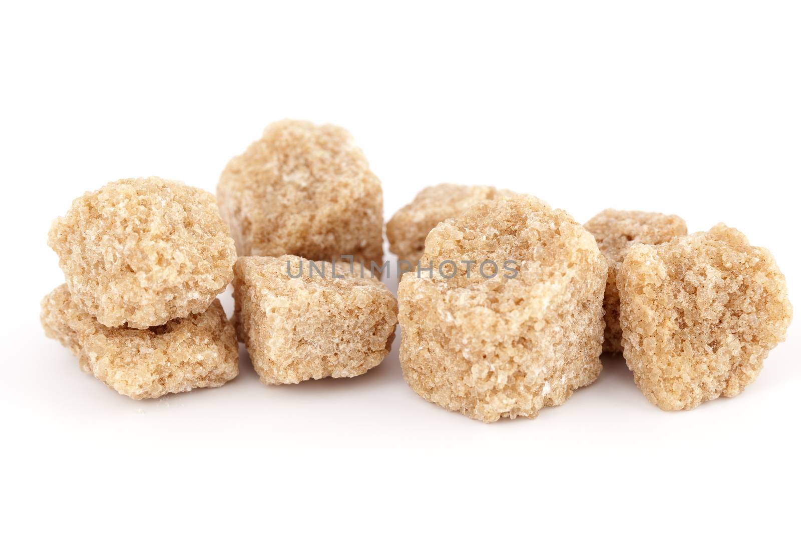 brown sugar in ankles on white background