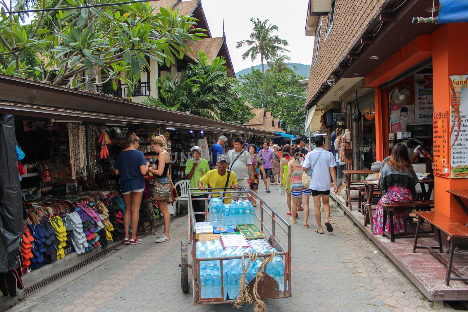 PHUKET, THAILAND NOVEMBER 29, 2013: Tourists shop at the old town market walking street. Koh PhiPhi Don in andaman sea, Krabi by evolutionnow