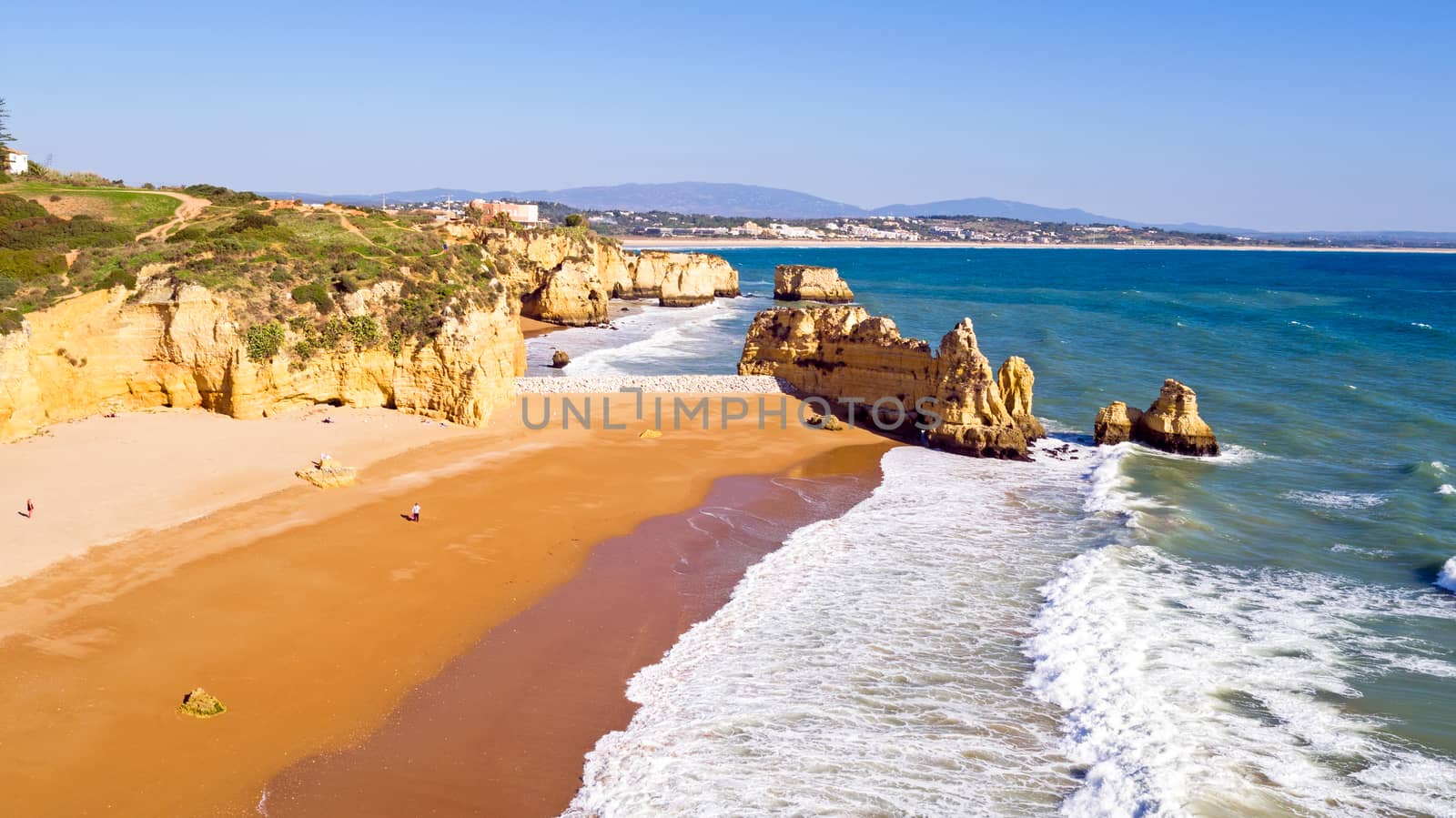 Aerial from rocks and ocean near Lagos in Portugal