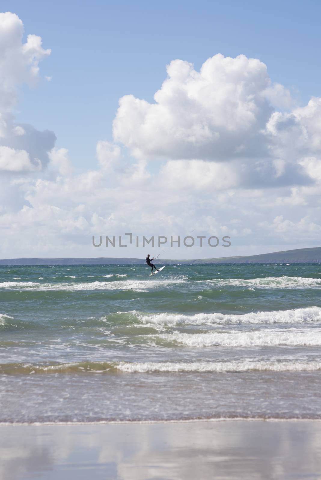 extreme kite surfer on beautiful waves at beach in ballybunion county kerry ireland on the wild atlantic way