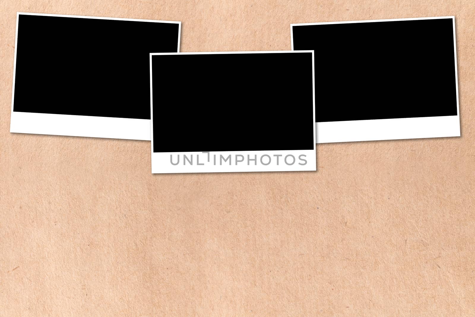 empty photographs on a background beige paper texture