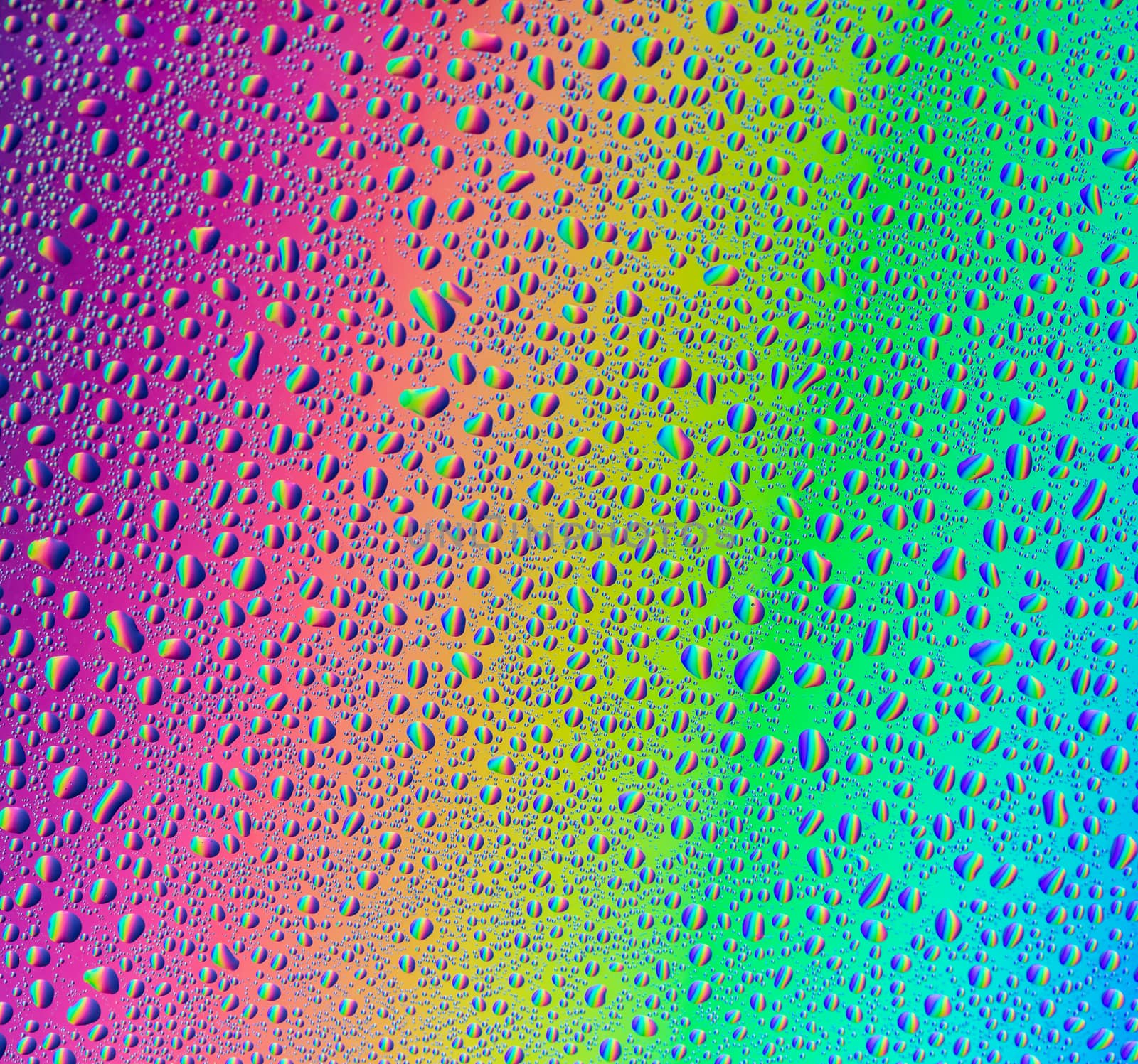 abstract background with water drops on multicolored surface