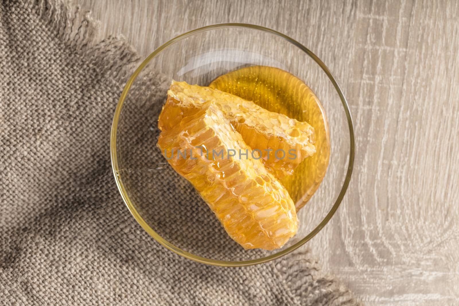 honeycomb with honey on the plate in a rustic style