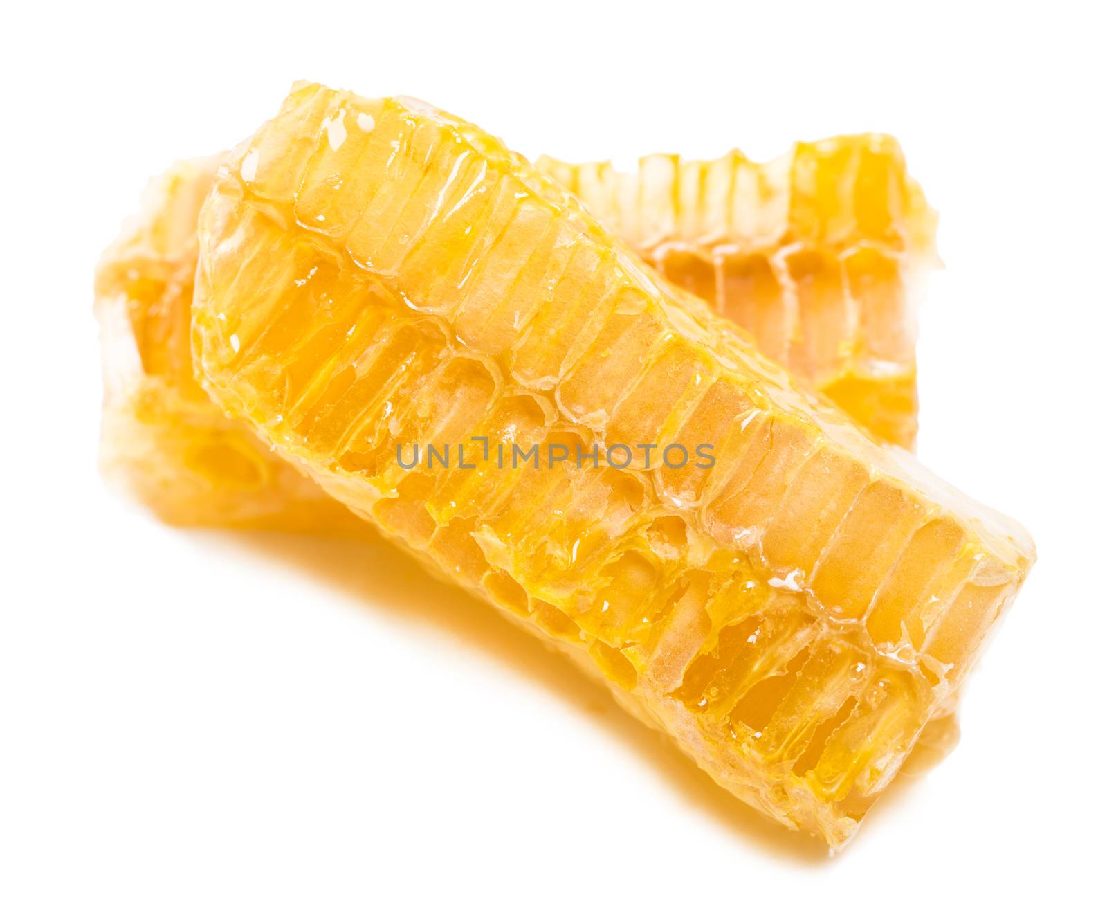 bee honeycomb with honey on a white background