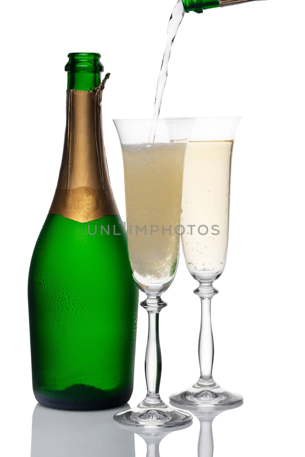 bottle and glasses of champagne on a white background