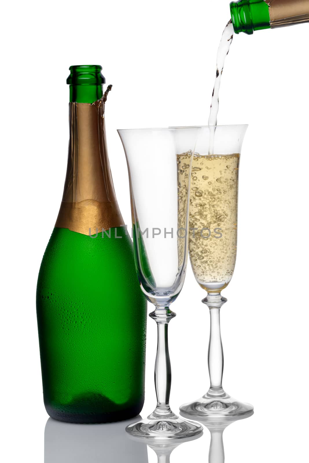 bottle and glasses of champagne on a white background