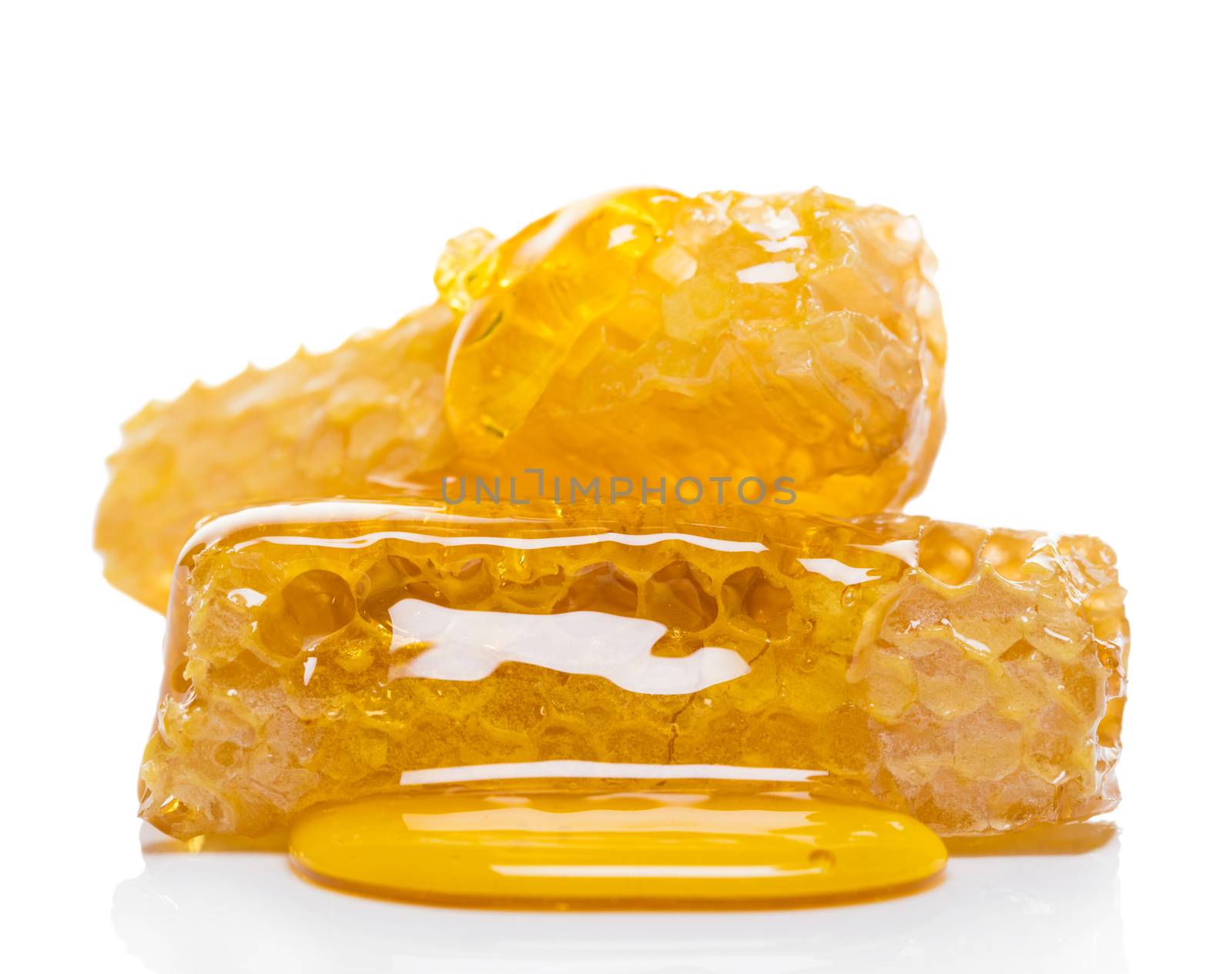 bee honeycomb with honey on a white background