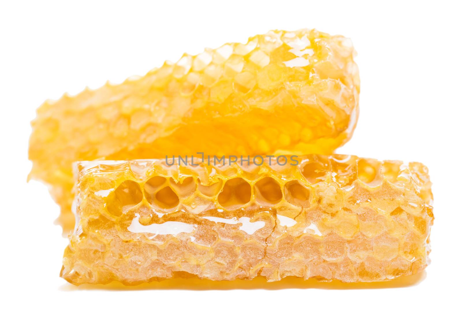 bee honeycomb with honey on a white background