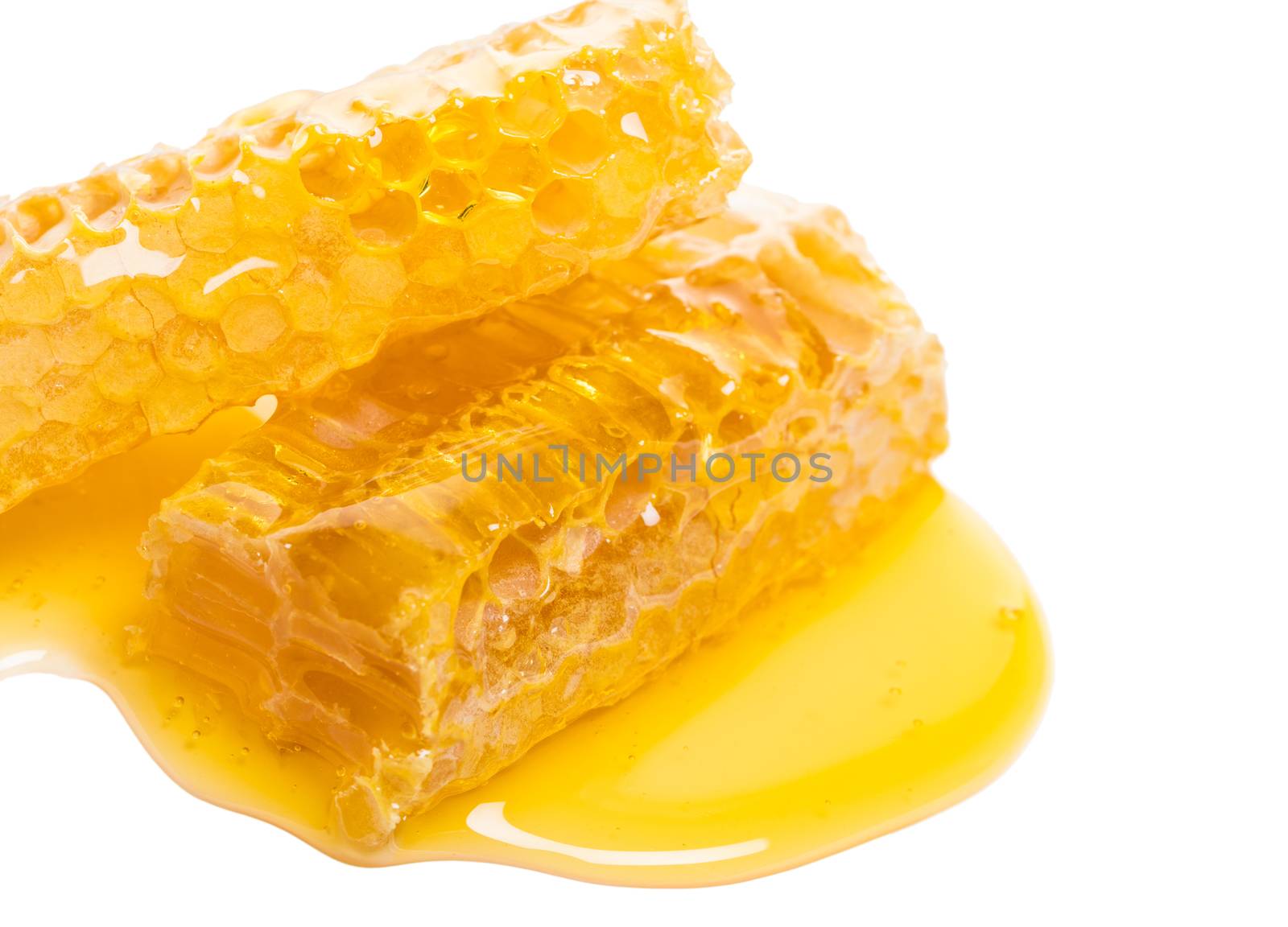 bee honeycomb with honey on a white background