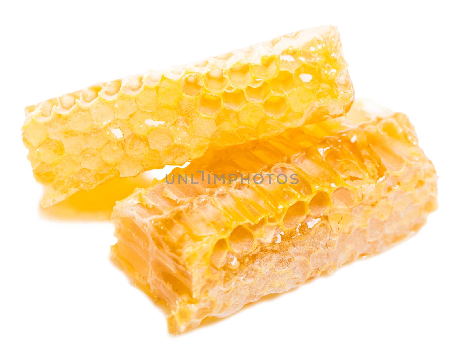 bee honeycomb with honey on a white background