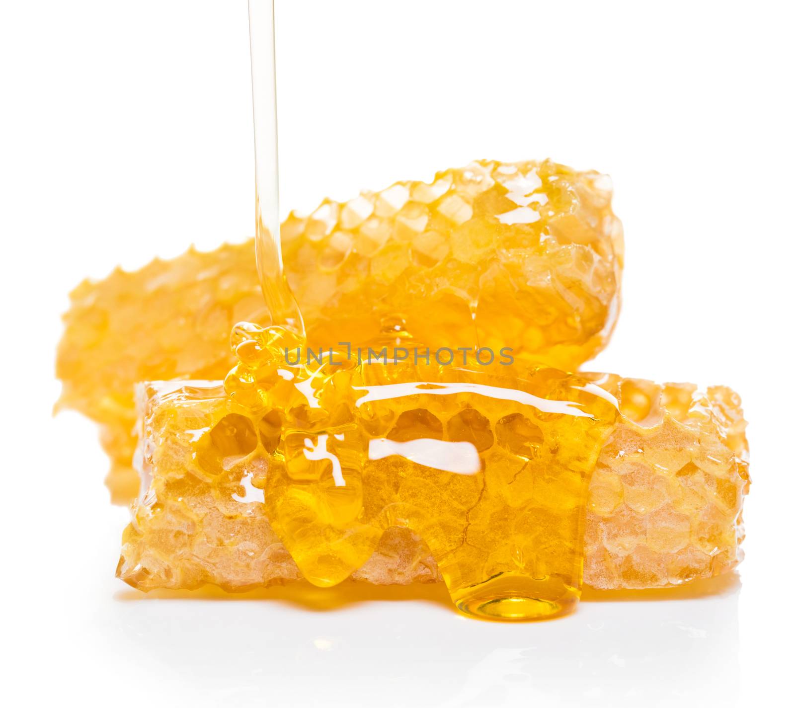 bee honeycomb with honey on a white background