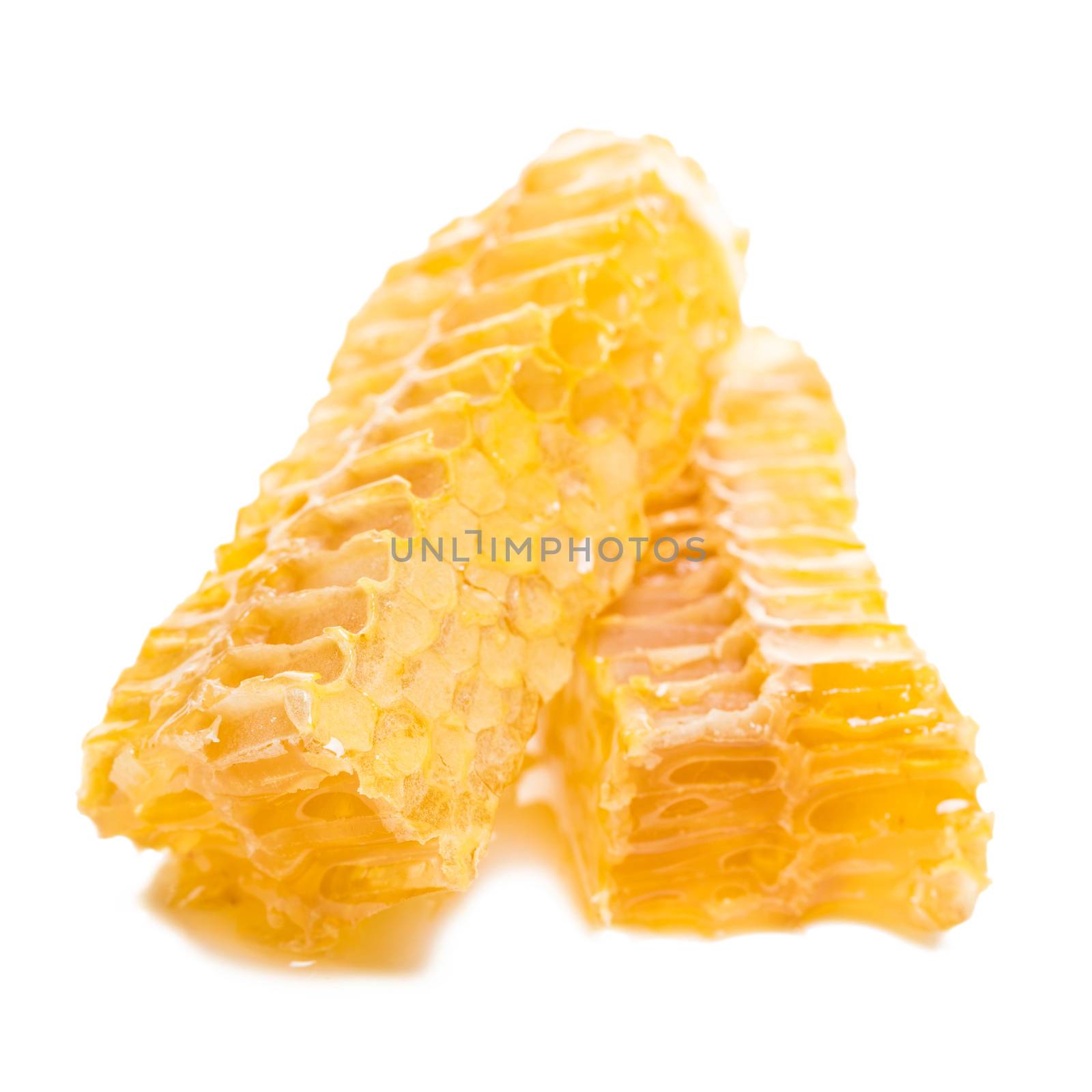 bee honeycomb with honey on a white background