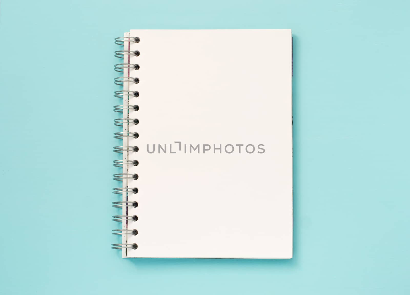 blank note paper on blue background by fascinadora