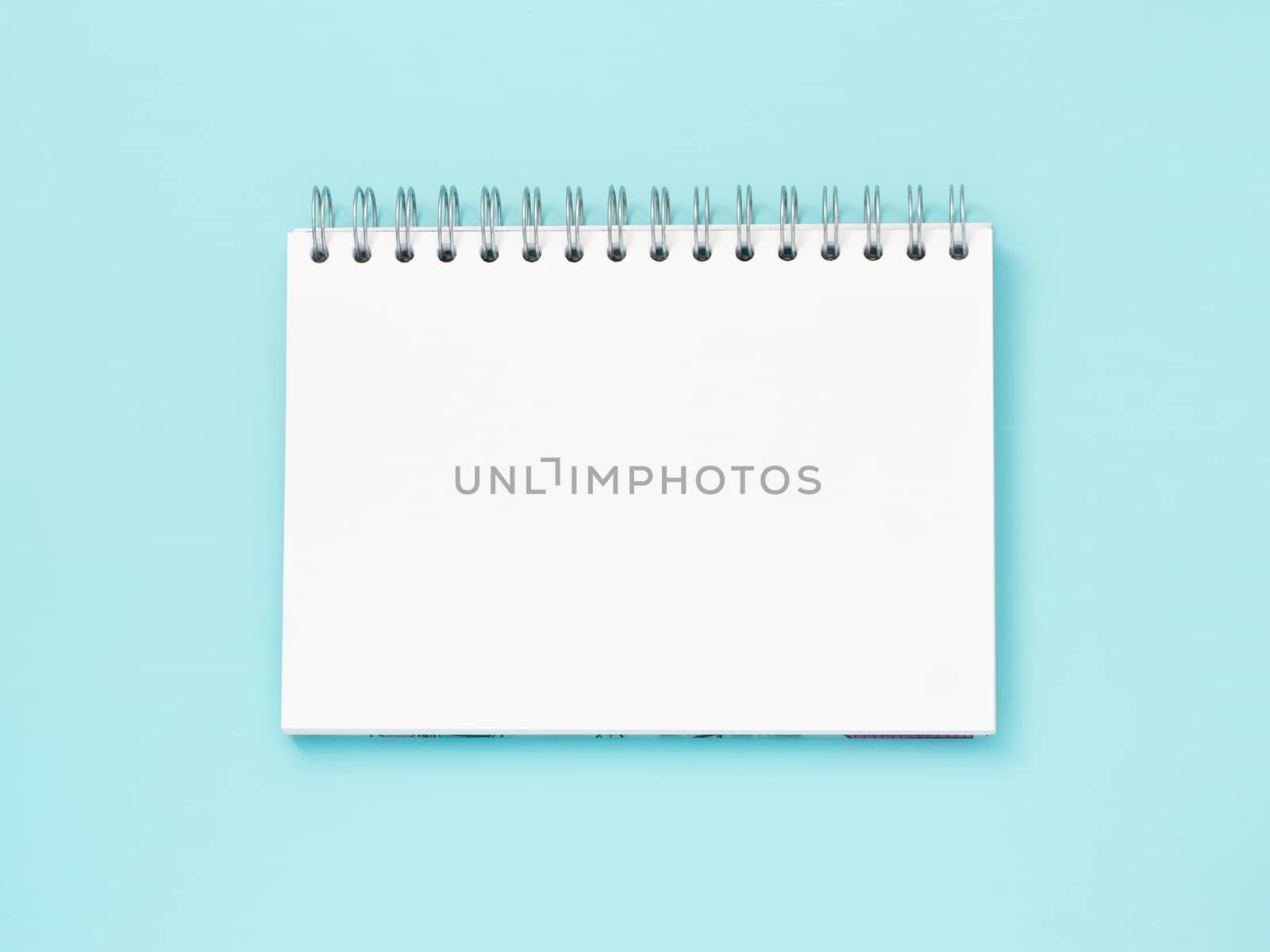 Top view of blank note paper blue wood table for background