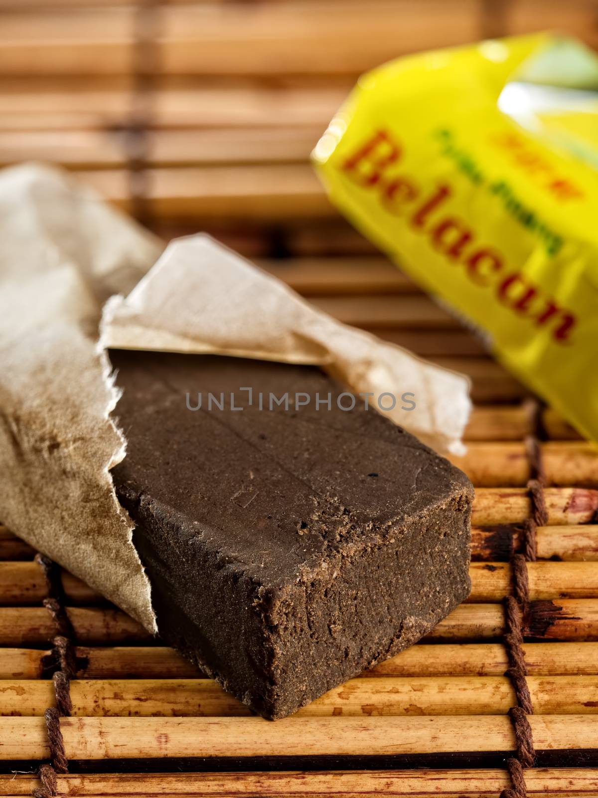 close up of a brick of belacan shrimp paste