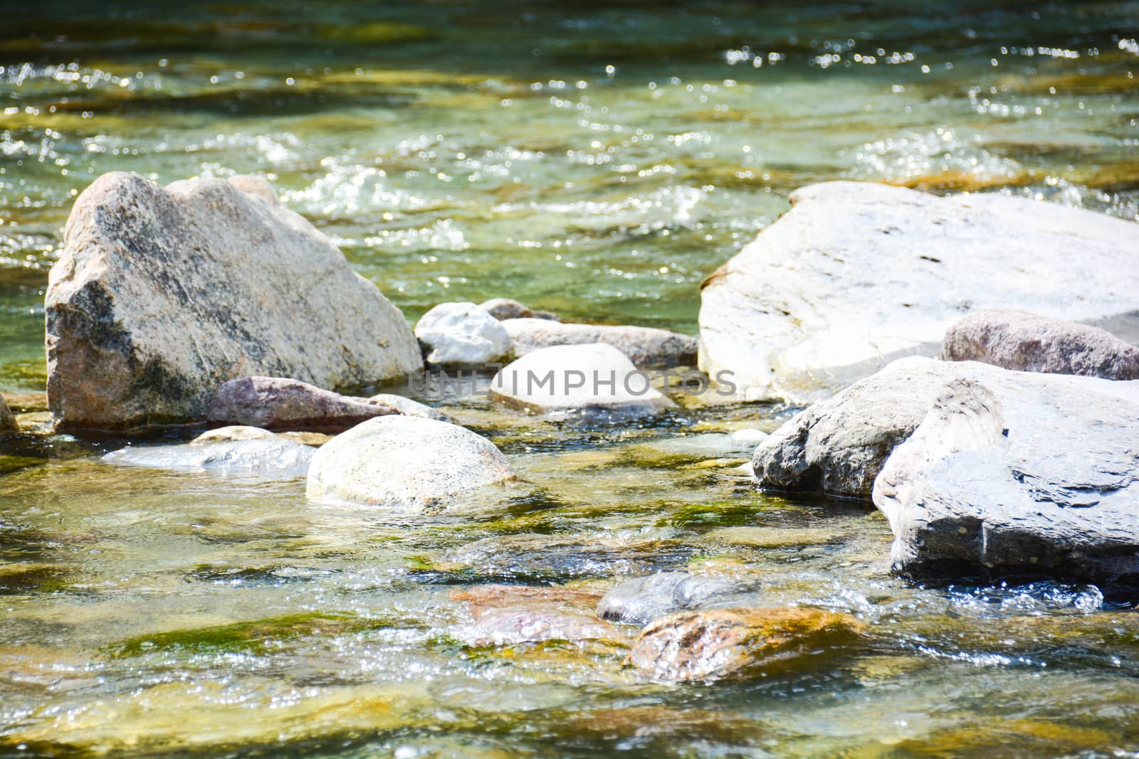 river and sea stones as background by iacobino