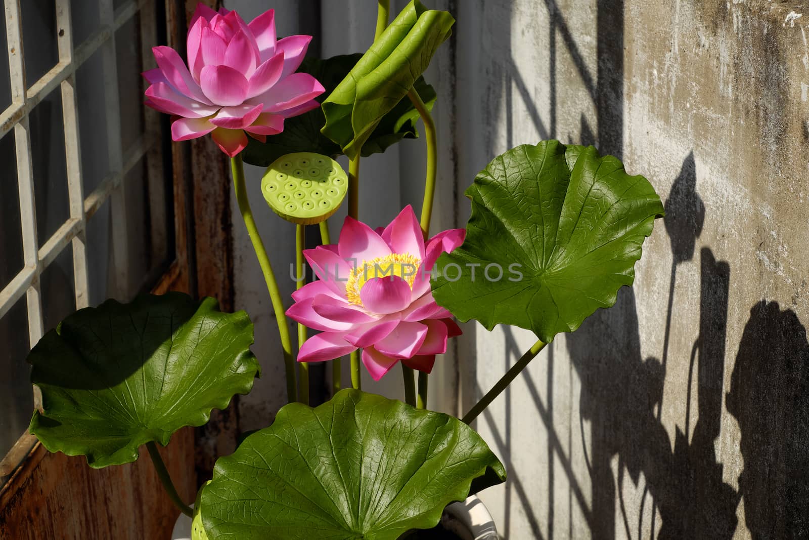 Artificial flower, handmade lotus flower with green leaf and pink petal make from clay, diy art product for home decoration